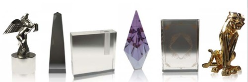 6 luxury gifts from our online boutique. From left to right, Pegasus Award, Modern Obelisk in Lucite, Crystal Bud Holder, Purple Gabrielle Crystal, SA Crystal Book, Imposing Cat