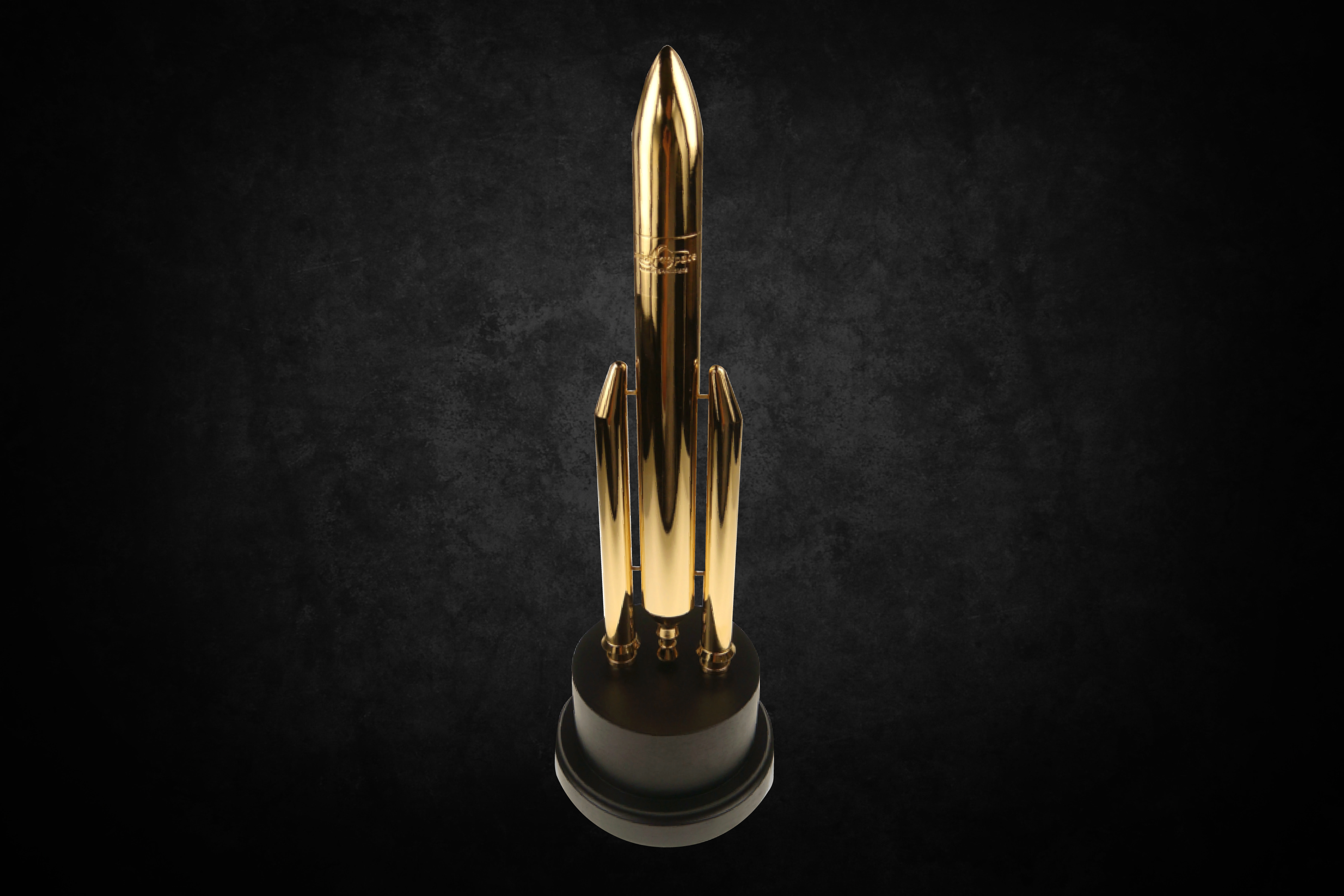 Arianespace Stellar Award, a high-end metal form modeled after the Ariane 5 Rocket and plated in 24k gold