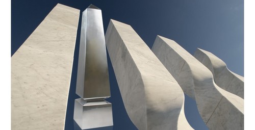 Modern Obelisk award in solid Aluminum from our Exclusives Collection. Award is superimposed over image of stone obelisks.