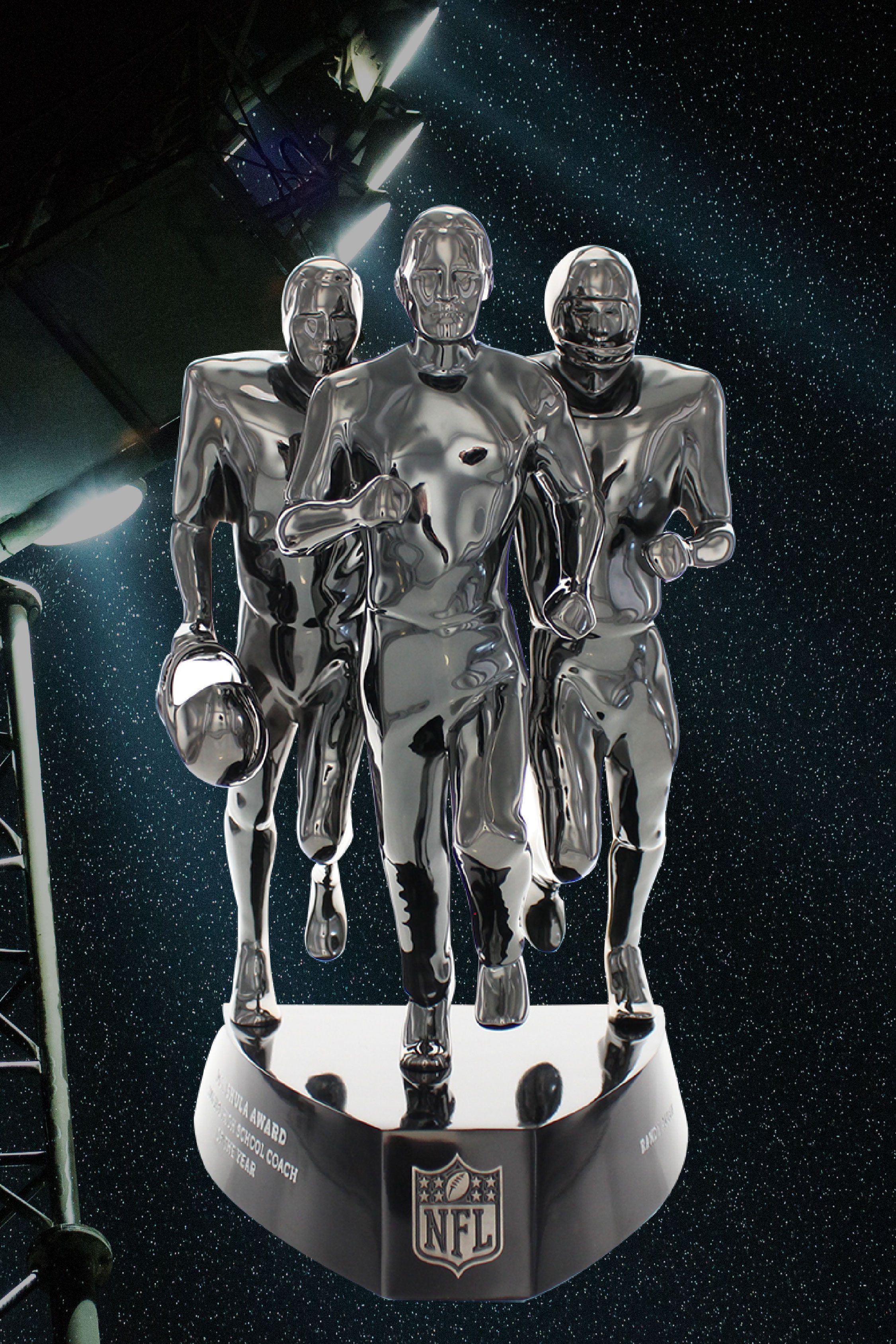 Front view, NFL Don Shula trophy superimposed over football stadium lights. Award has 3 metal figures in running pose