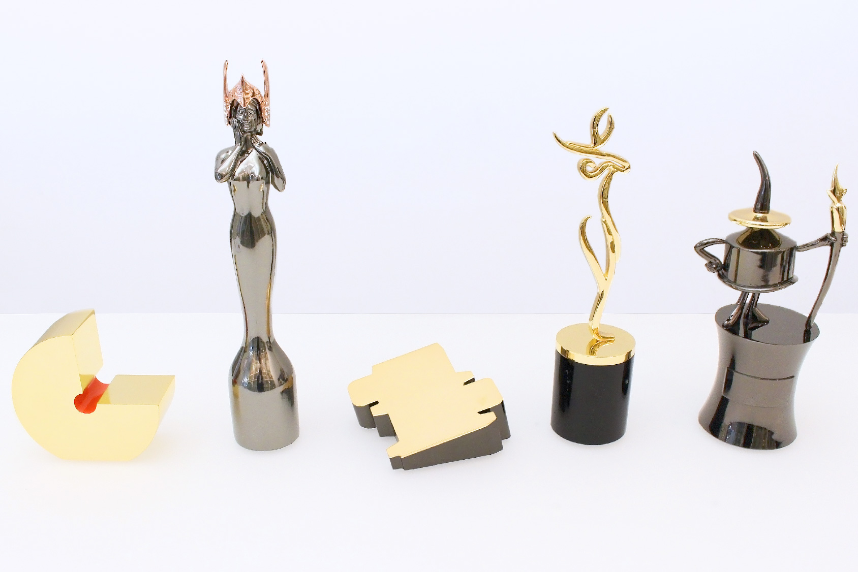5 famous custom trophies by Society Awards on a conference table