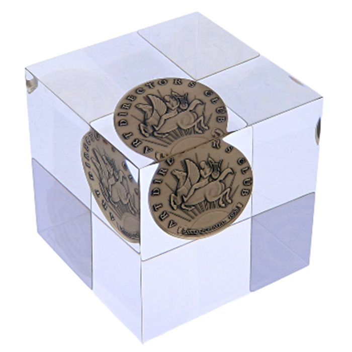 Art Director Club Awards Paul Manship Award custom trophy from Society Awards. Custom acrylic cube with the paul manship medal suspended within and minted at Society Awards 