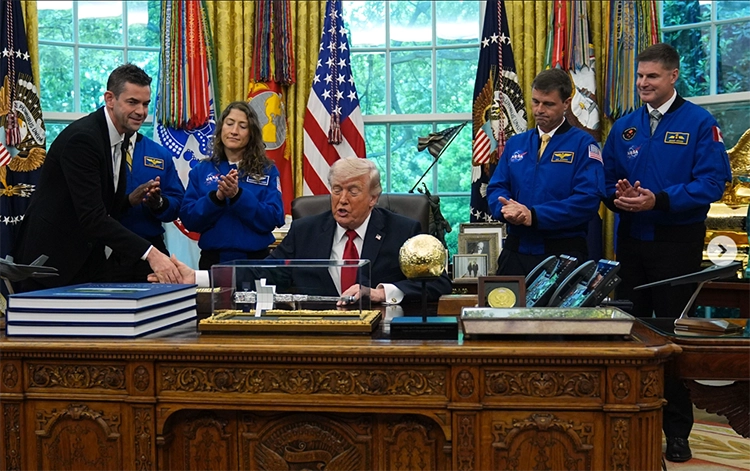 Administrator Jared Isaacman shakes hands with President Trump during a press conference
