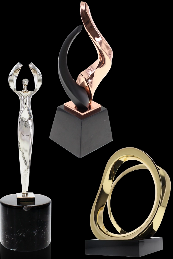 The Silver Nambe Angel, Bronze Nambe Lark, and Gold Nambe Tempo trophies made between the partnership between Society Awards and Nambe