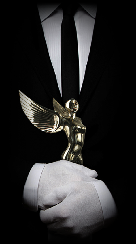 Gold Angel Trophy and Man in Suit