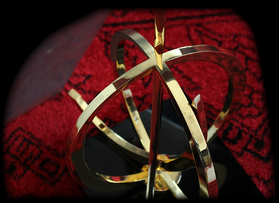 Gold Rings Sculpture on Red Carpet