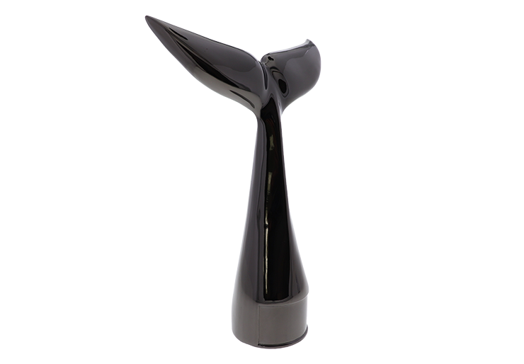Custom award in the shape of a whale tail in the color black