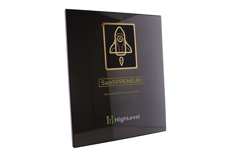 Custom black plaque with a gold rocket ship depiction and company personalization