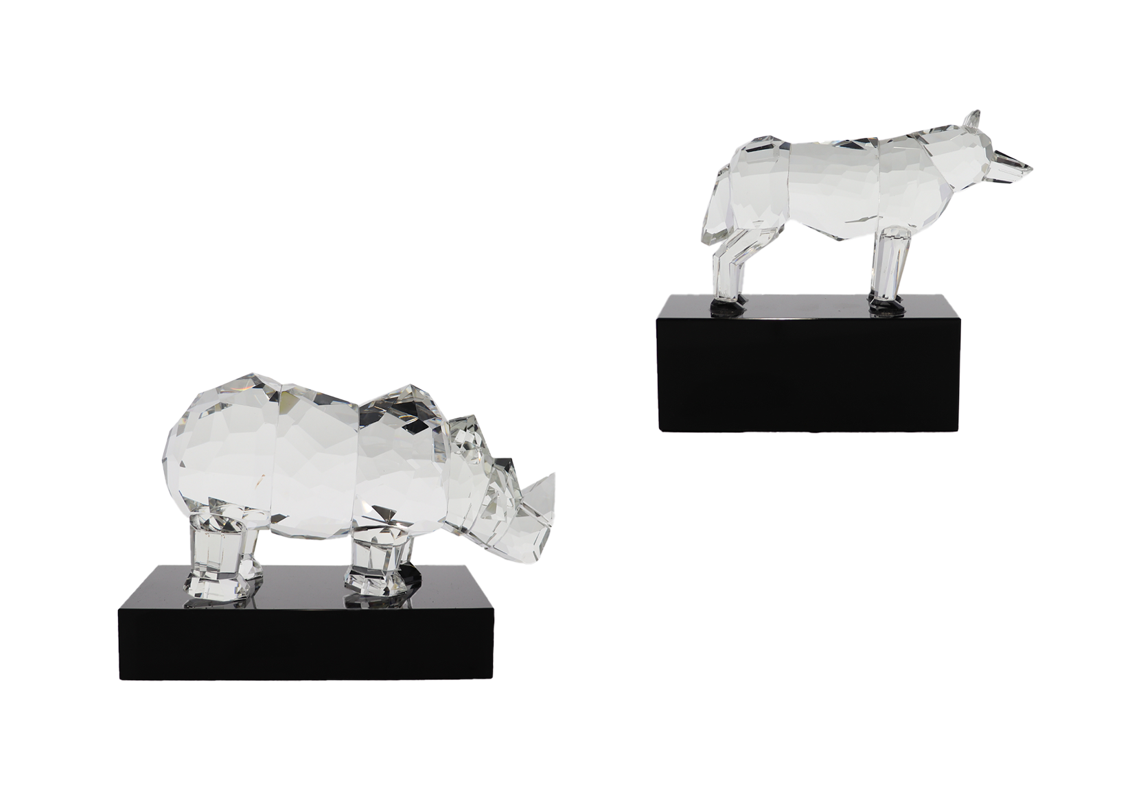 Custom crystal wolf and rhino atop rectangular black bases | Society Awards