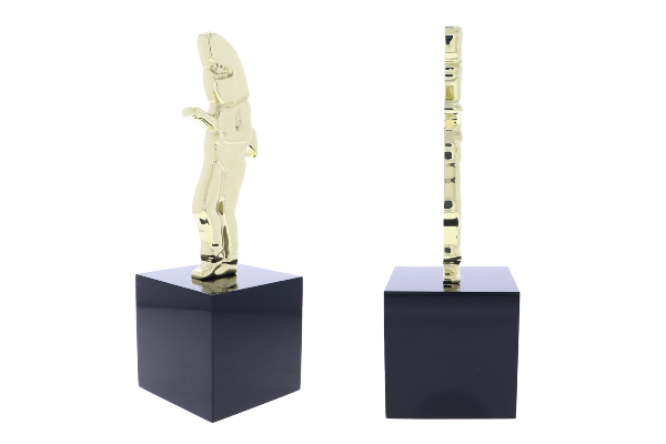 Custom flat shark award atop a black square base