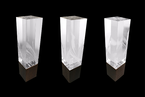 Custom etched crystal atop a black square base