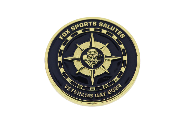 Custom black sports coin with gold compass detailing