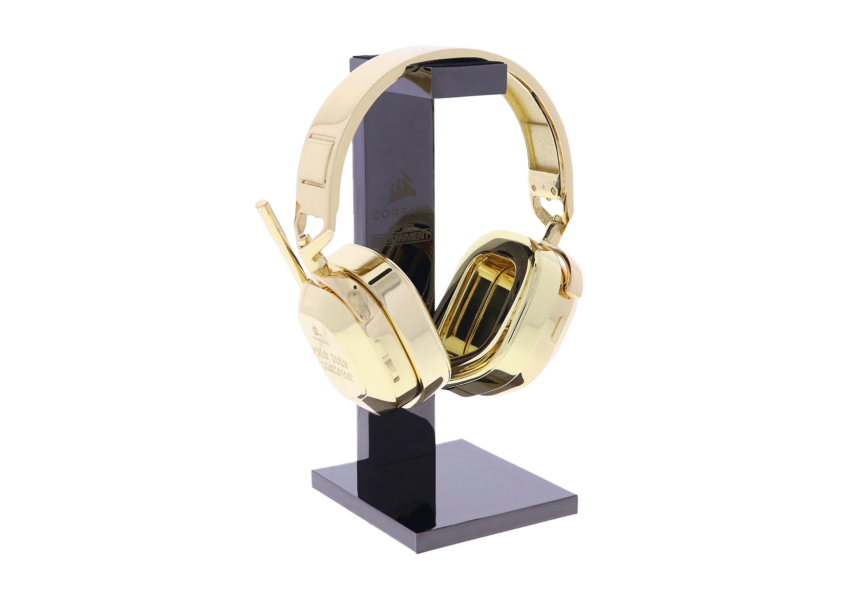 Custom gold headset hanging from a black stand | Society Awards
