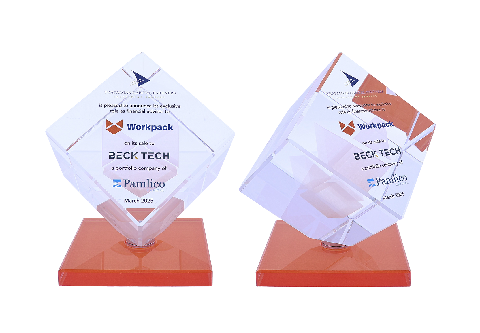 Decorated spinning tilted cube atop an orange base | Society Awards