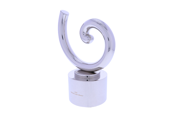 Silver sculptural swirl atop a cylindrical base