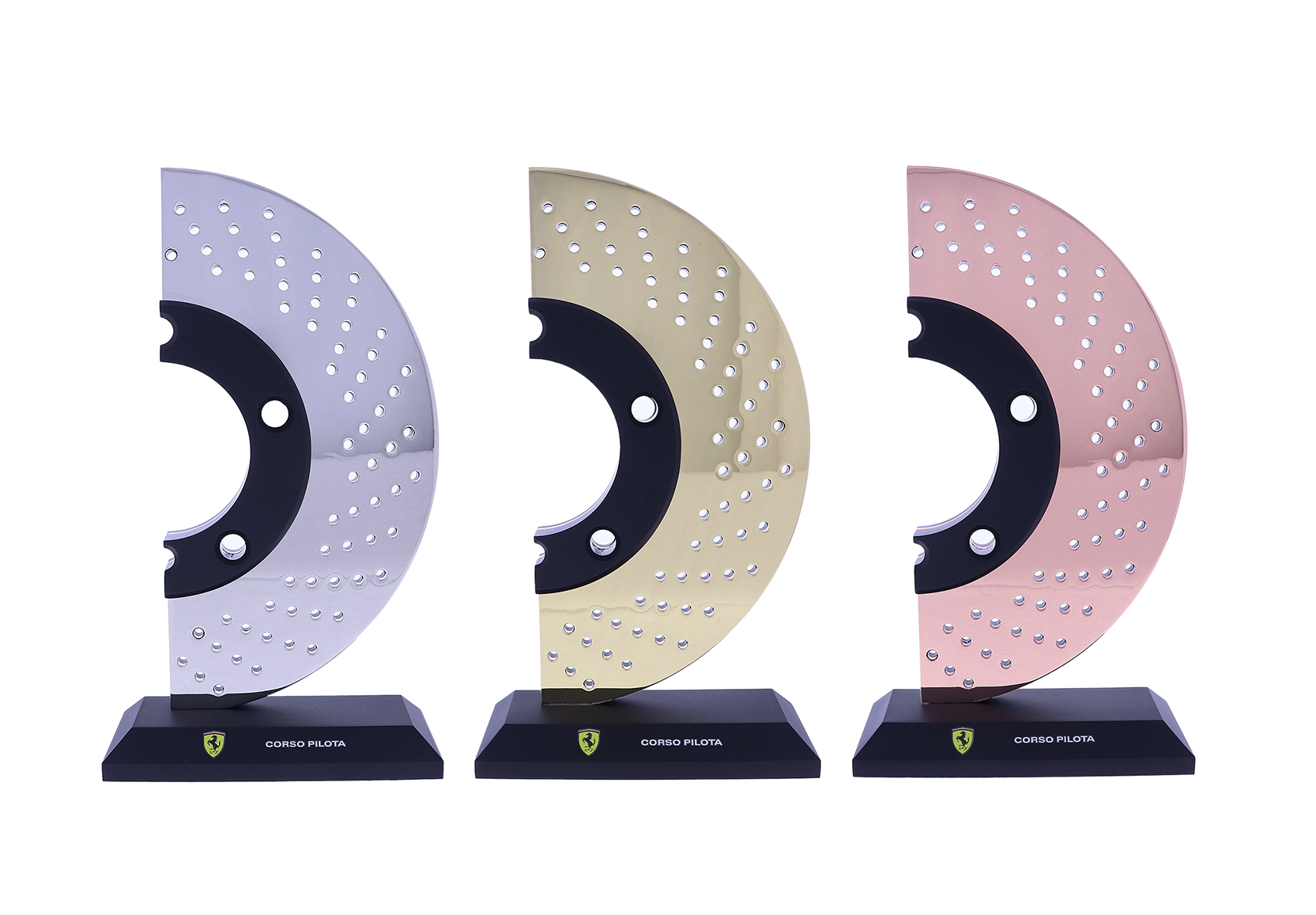 Gold, silver, and bronze car brake rotors atop black bases | Society Awards