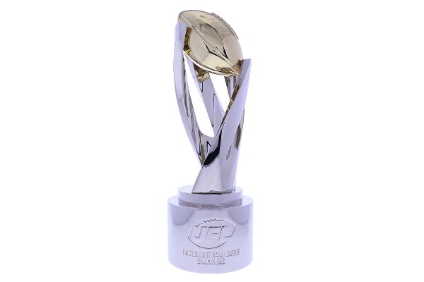 Impressive football trophy with sweeping silver arms hoisting a gold football