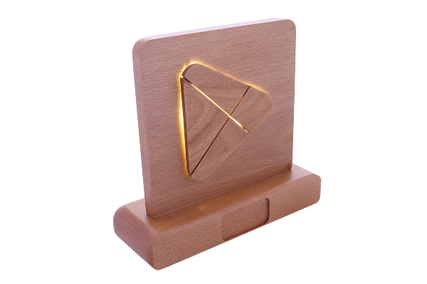 Wooden plaque with a backlit play button