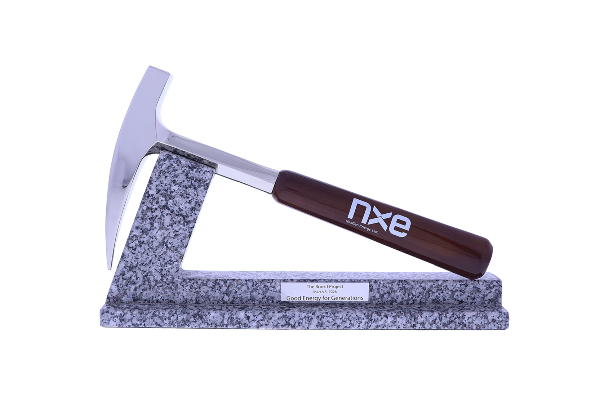 Sleek hammer resting atop a marble base