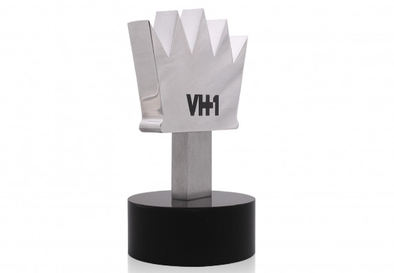 Metal crown award with polished sides mounted on black base.