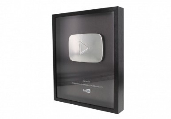Silver play button plaque.