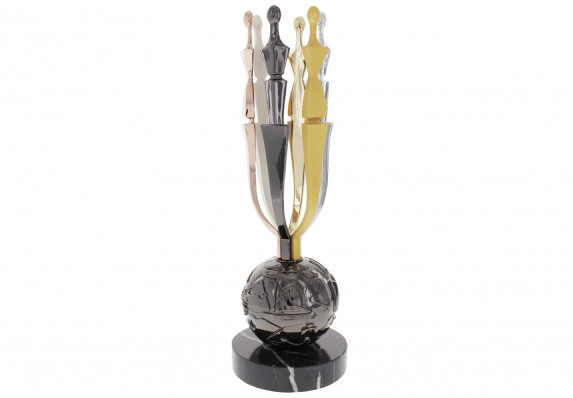 Hand assembled award in many metallic finishes. Designed in collaboration with Ruben Toledo