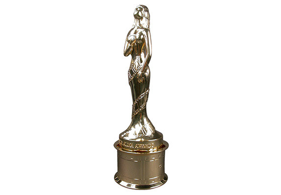 Award statuette custom crafted in gold. Form is a woman with feel reel on film reel base