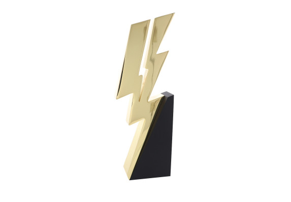 Electroplated metal lightning bolt atop a black wooden base
