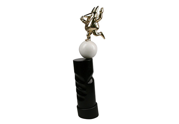 Whimsical trophy using golden figure marble ball and hand carved wood