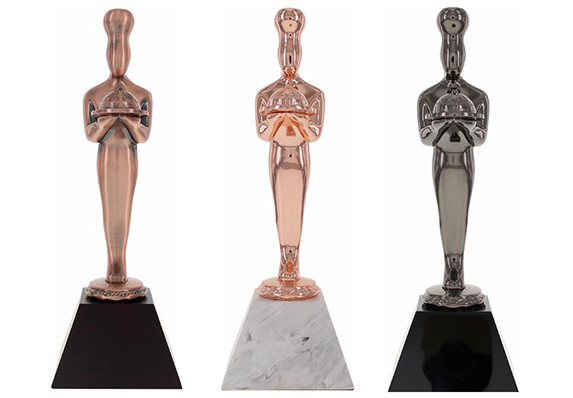 Custom Awards crafted in metal with a variety of luxury electroplated finishes and mounted on crystal and marble bases.