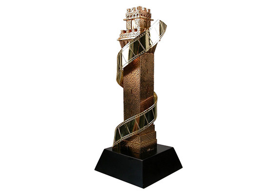 custom building sculpture with encircling film reel gold plated