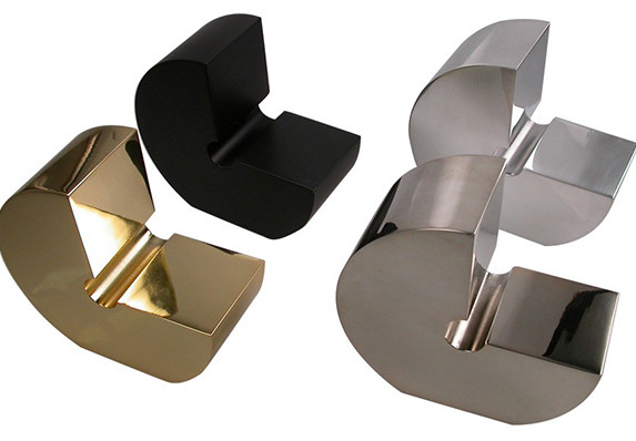 Trophy in 'G' shape in different colors and finishes. Award is presented for excellence in design and creative.