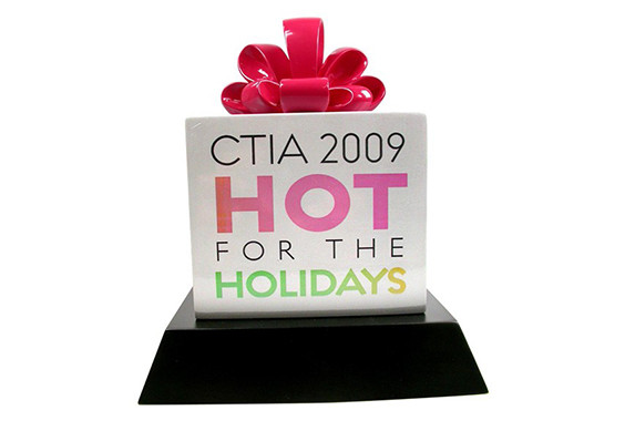 3 dimensional gift box sculpture award in brightly painted colors