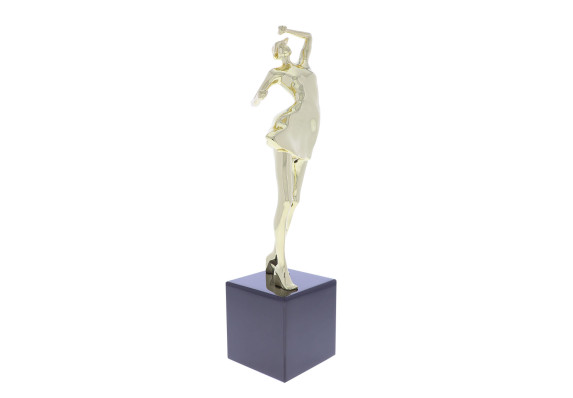 Statue of a gold dancer, atop a black base