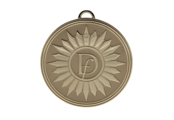 Circular gold metal with sunburst design and company logo