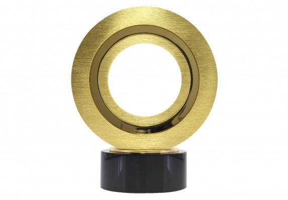 A metal ring trophy custom crafted in matte and polished gold is mounted on a luxury black awards base.