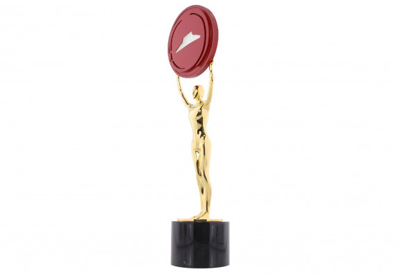 A custom cast figure plated in 24K gold holding up a red plaque with the brand's iconic logo.