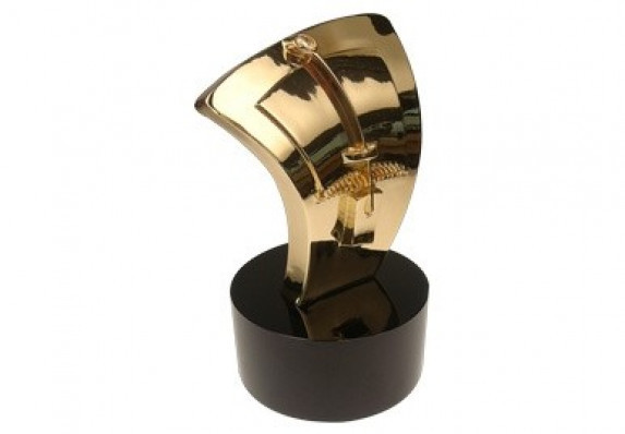 Gold plated cast metal mousetrap design on a black crystal base.