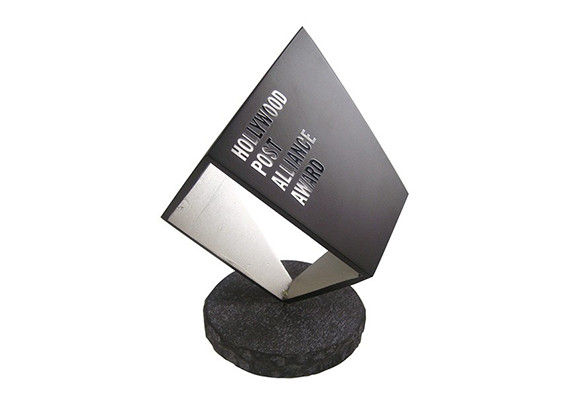 Abstract sculpture trophy on faux granite base. Logo is printed with gloss finish to contrast matte black surface.