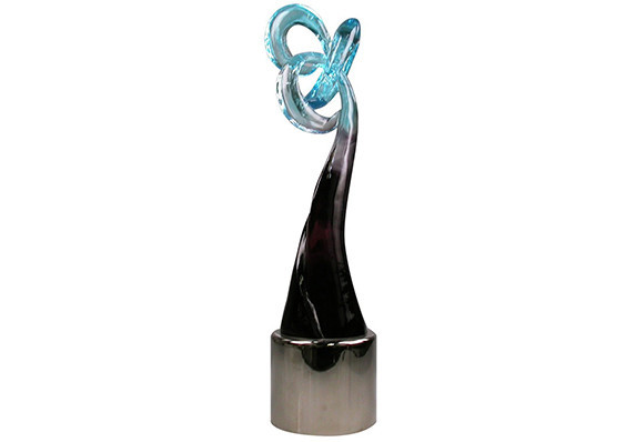 Gorgeous pate de verre cast crystal sculpture with color fade. Art glass sculpture is mounted on a polished metal base.