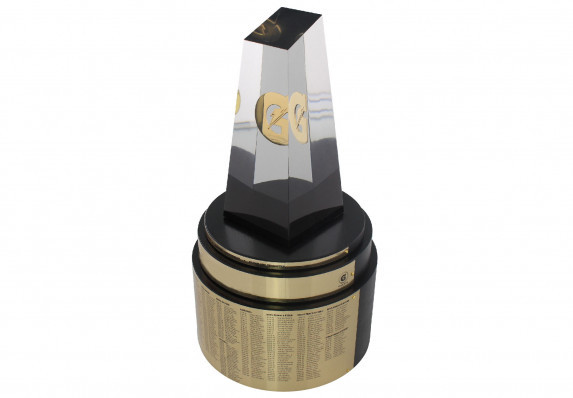 This custom perpetual trophy is crafted in high-end acrylic with a metal logo embedment. The form is mounted atop a large wood base with gold personalization plates.