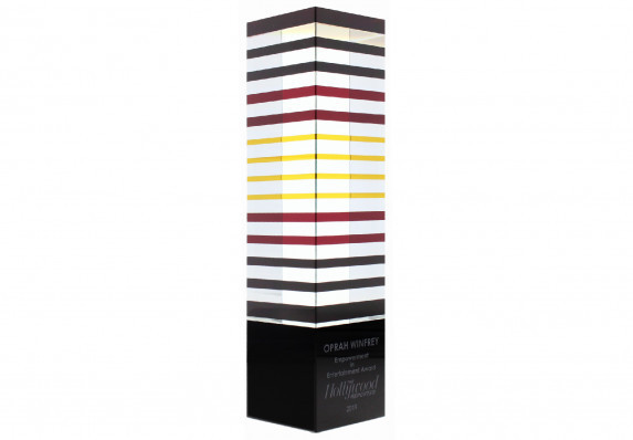 An artful, layered crystal award was customized with logo and copy to be presented to Oprah Winfrey for Empowerment in Media. This unique design is part of our Exclusives Collection.