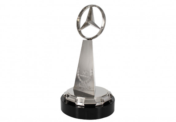 Polished chrome silver award with high end cast metal logo on pedestal and base.