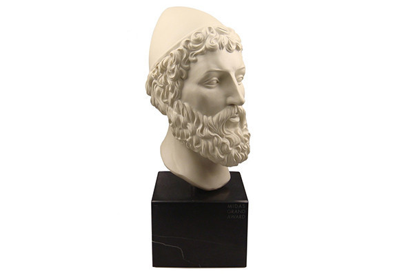 Bust sculpture of King Midas mounted on a black base.