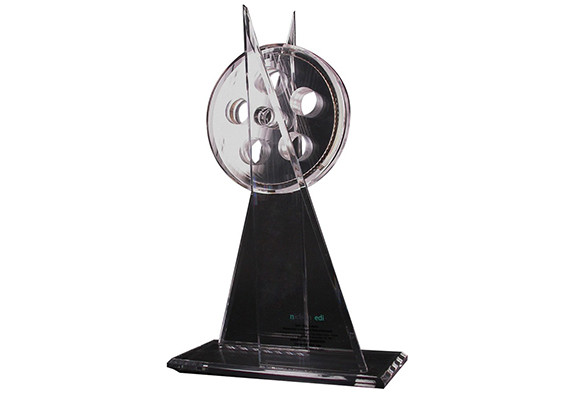 Abstract film reel sculpture in acrylic
