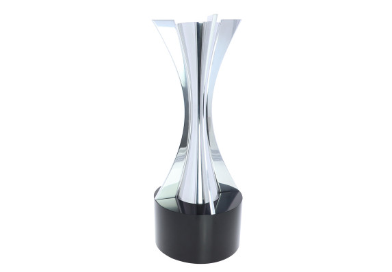 Elegant metal statue with precisely machined curves on a black base