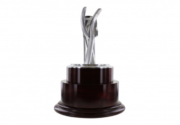 Large and prestigious trophy with a highly-detailed, cast-metal form mounted on a lacquered luxury wood base.