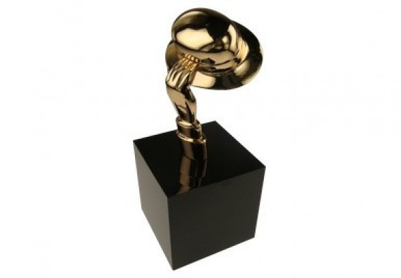 Gold plated award with a hand holding a bowler hat on a black base.