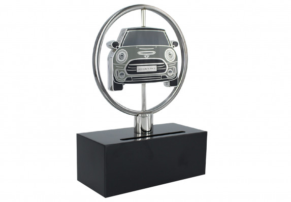 Spinning custom award designed in the image of a new model vehicle. The vehicle ‘medallion,’ finished with high-end enamel, is two-sided and can be turned to reveal a likeness of the rear end of the car on the reverse.