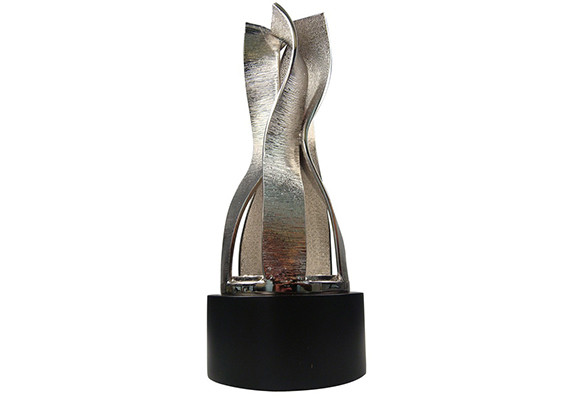Undulating ribbons in cast metal silver plated creating a custom award